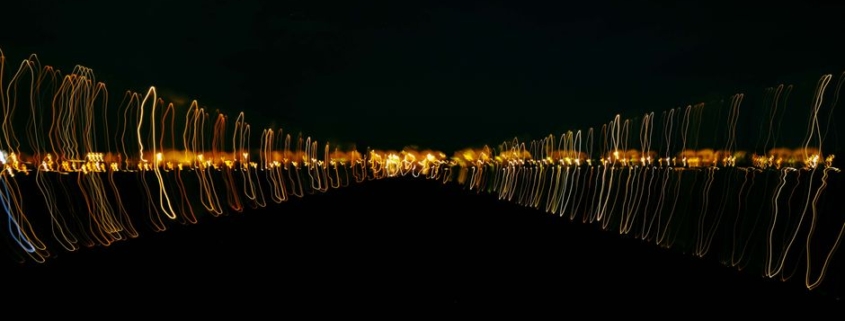 Two glowing, futuristic paths diverge from a single point, representing the choice between traditional search results and ...